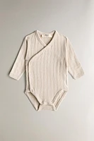 CHILDREN’S SET OF BODYSUITS