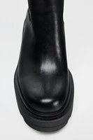 BOTTES À TALONS ET SEMELLE TRACK
