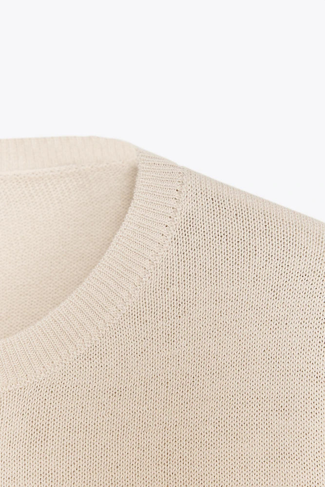 PULL EN MAILLE UNIE AVEC LAINE