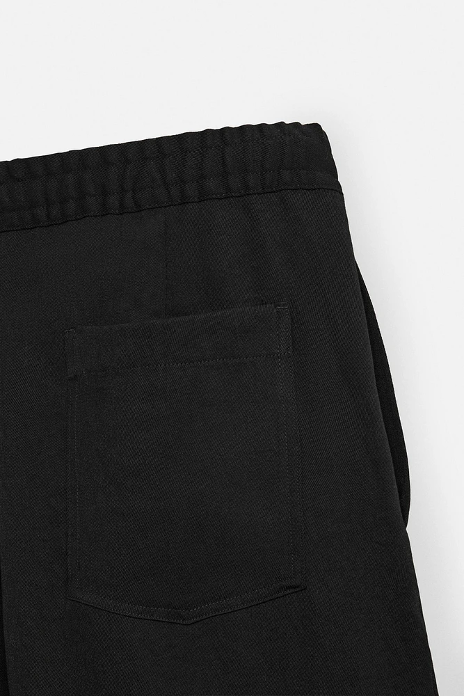 FLOWY PLEATED PANTS
