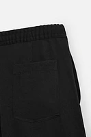 FLOWY PLEATED PANTS