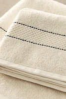 SERVIETTE DE BAIN BORDURE SURPIQÛRES