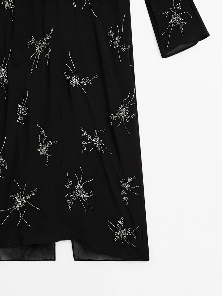 Robe midi fluide avec broderies