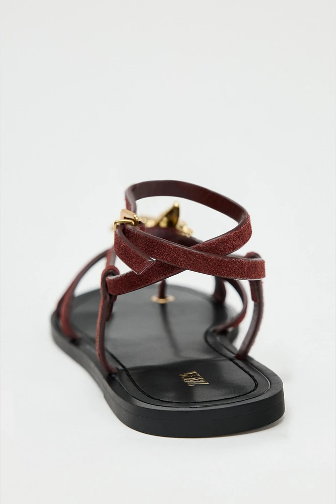 FLAT SUEDE SANDALS WITH METALLIC PIECE