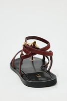 FLAT SUEDE SANDALS WITH METALLIC PIECE