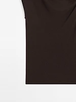 Top asymétrique avec nœud