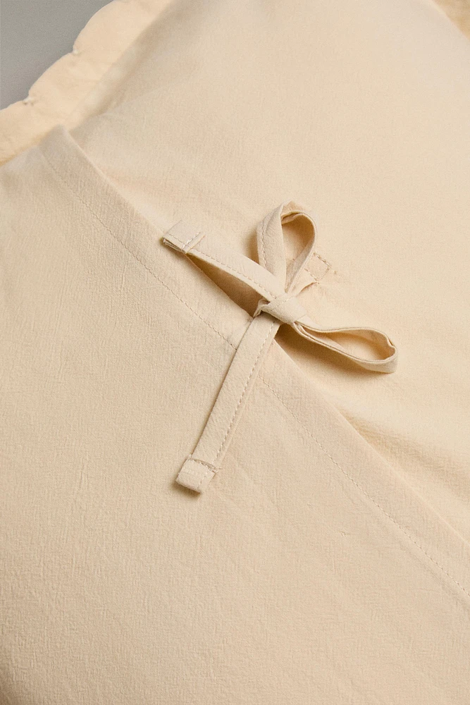 HOUSSE DE COUSSIN ENFANT BORD AJOURÉ