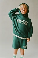 SWEAT À CAPUCHE IMPRIMÉ