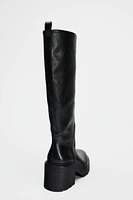 BOTTES À TALONS ET SEMELLE TRACK