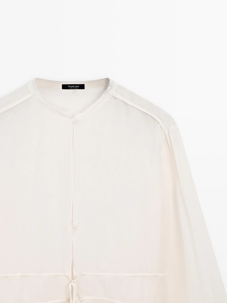 Flowing semi-sheer blouse with ties