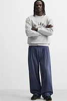 JEAN RELAXED FIT À PLIS