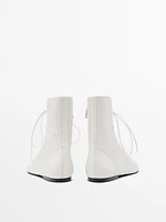 Lace-up flat ankle boots
