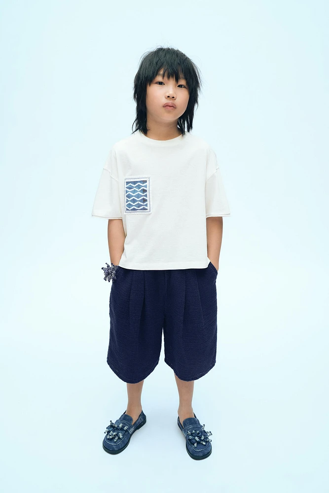 X FANGLU LIN PATCH T-SHIRT