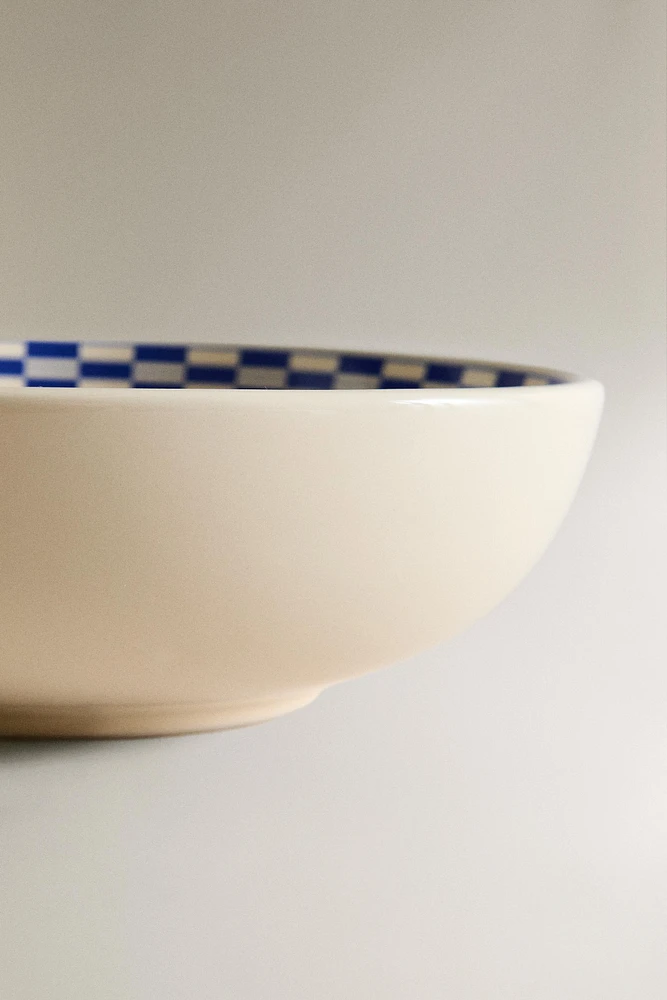 CERAMIC BOWL WITH A CHECKED DESIGN ON THE RIM