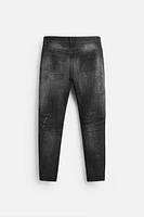 SPLATTERED RIPPED SKINNY JEANS