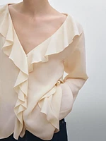 Ruffled blouse with asymmetric hem