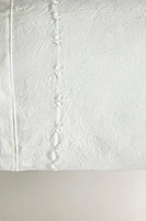 CHILDREN'S BOLSTER CUSHION WITH EMBROIDERED DESIGN