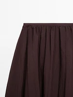 Pleated balloon midi skirt