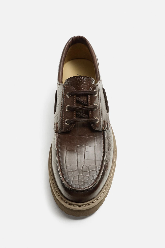 EMBOSSED BOAT SHOES