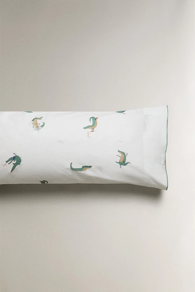 TAIE D’OREILLER ENFANT CROCODILE