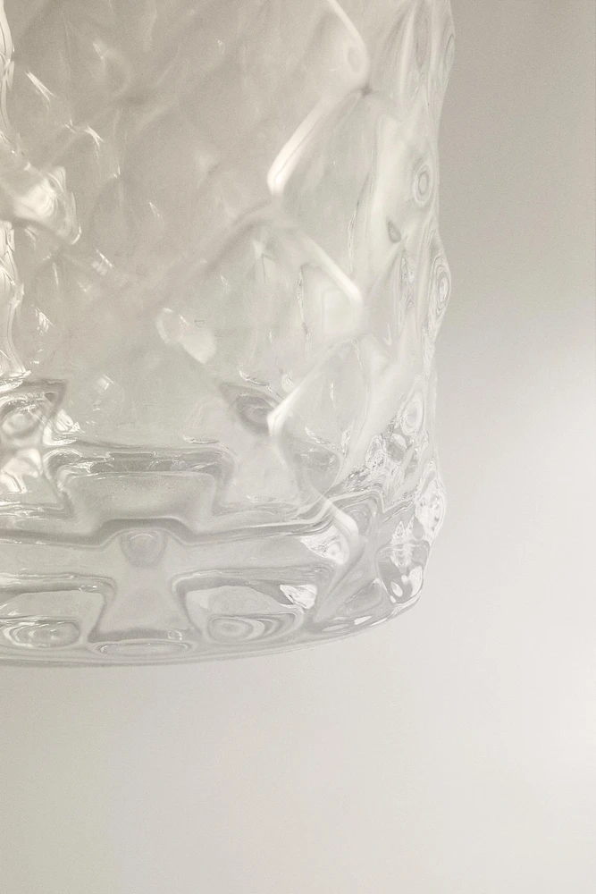 CRYSTALLINE TUMBLER WITH RAISED DESIGN