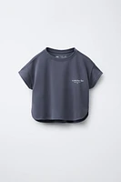 FLOWY TEXT T-SHIRT