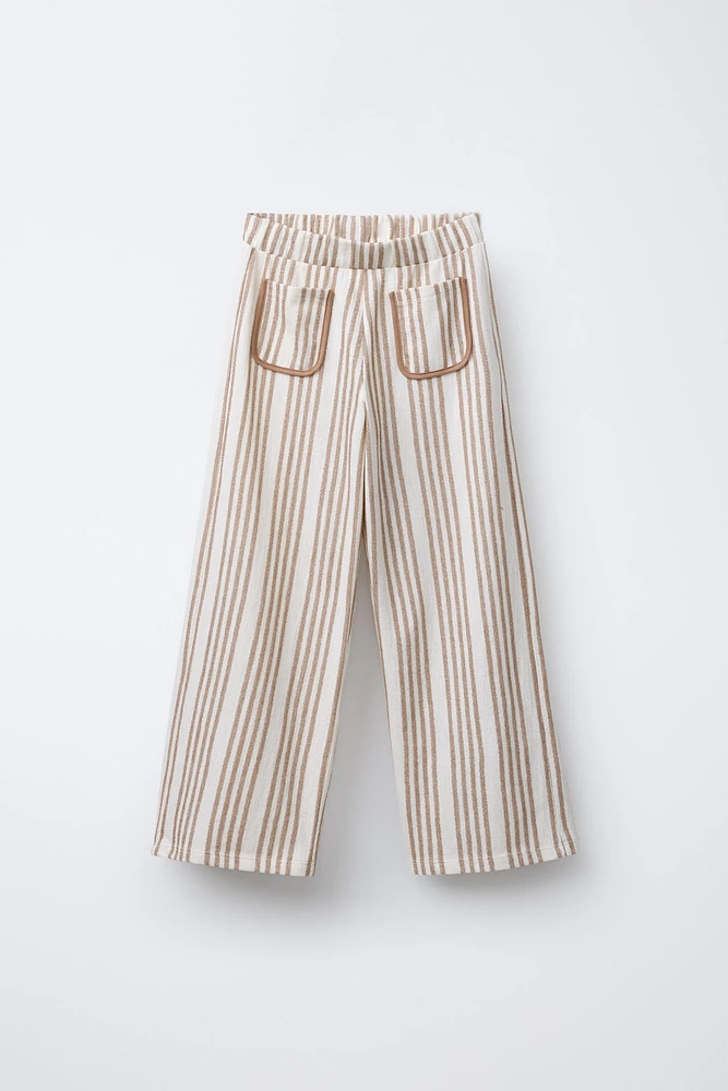STRIPED PANTS WITH PIPED POCKETS