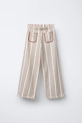 STRIPED PANTS WITH PIPED POCKETS