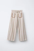 STRIPED PANTS WITH PIPED POCKETS