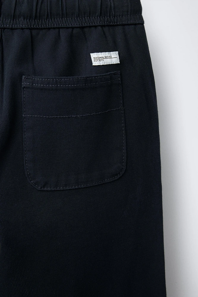 TEXTURED STRETCH PANTS