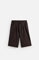 PLEATED OVERSIZED FIT BERMUDA SHORTS