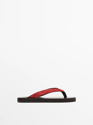 Split suede sandals with toe divider