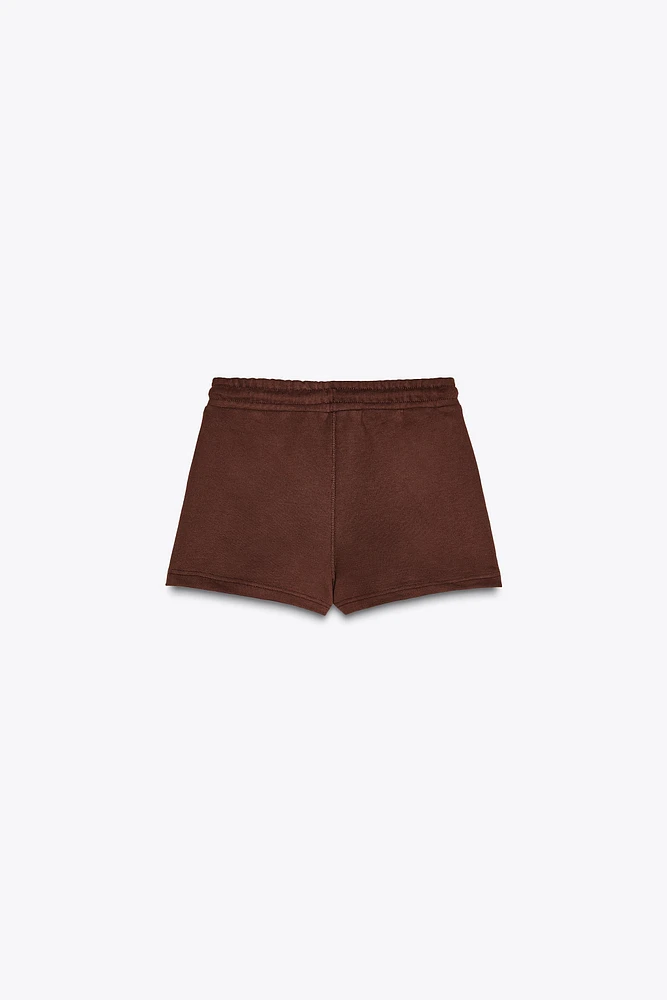 THE WHITE LOTUS FLEECE SHORTS