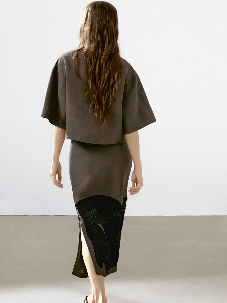 Flowing blouse with contrasting ribbons
