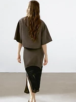 Flowing blouse with contrasting ribbons