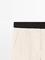 Pantalon flare taille contrastante