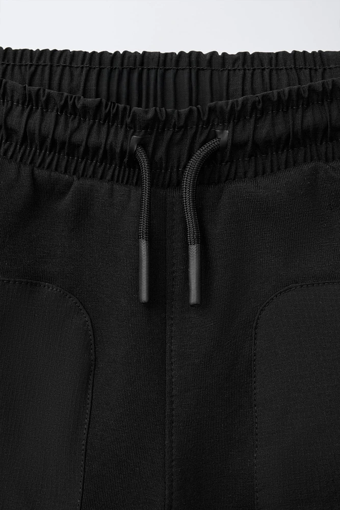 BERMUDA SPORT EN MATIÈRES VARIÉES