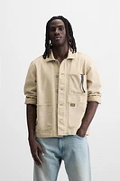 VESTE DÉLAVÉE À ÉCLABOUSSURES