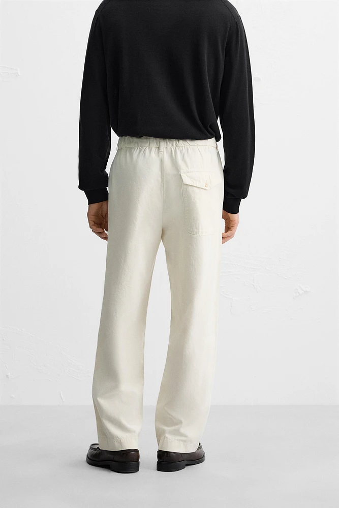 RELAXED FIT PLEATED PANTS