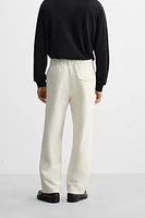 RELAXED FIT PLEATED PANTS