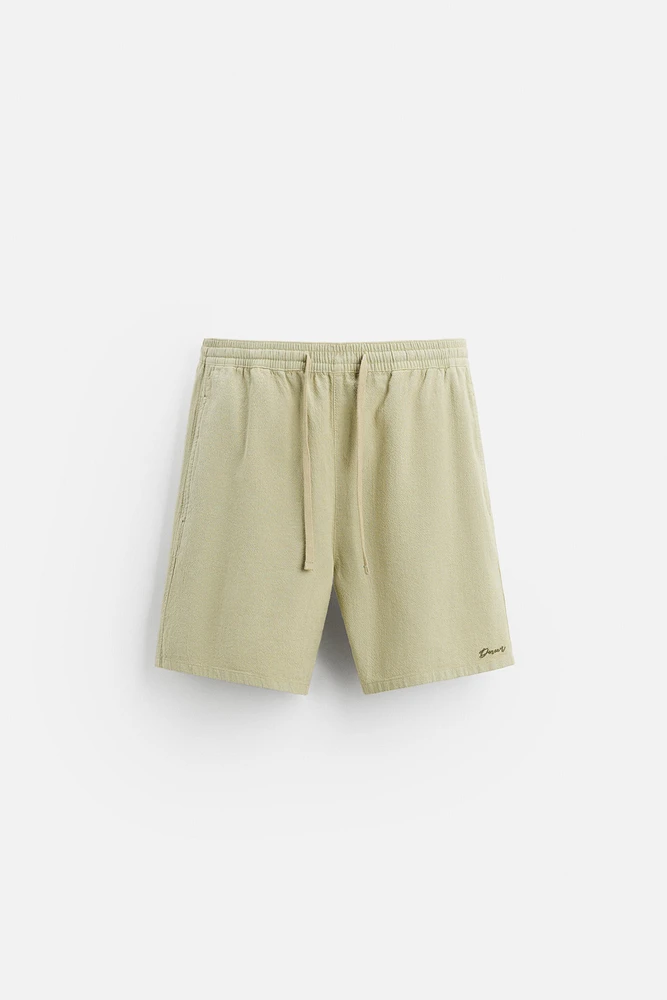 TEXTURED EMBROIDERED SHORTS