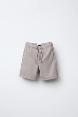 PIQUÉ STRETCH SHORTS