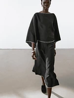 Cape blouse with batwing sleeves