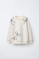 DRAWSTRING TIE SWEATSHIRT