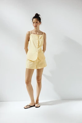 TOP GILET À BOUTONS