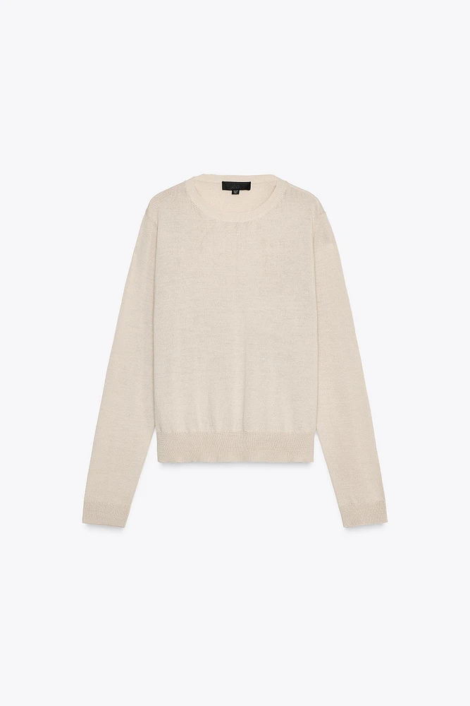 PULL EN MAILLE UNIE AVEC LAINE