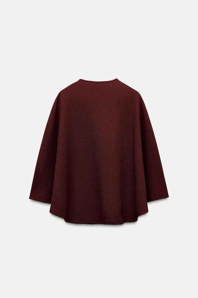 BUTTON CAPE