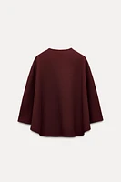 BUTTON CAPE