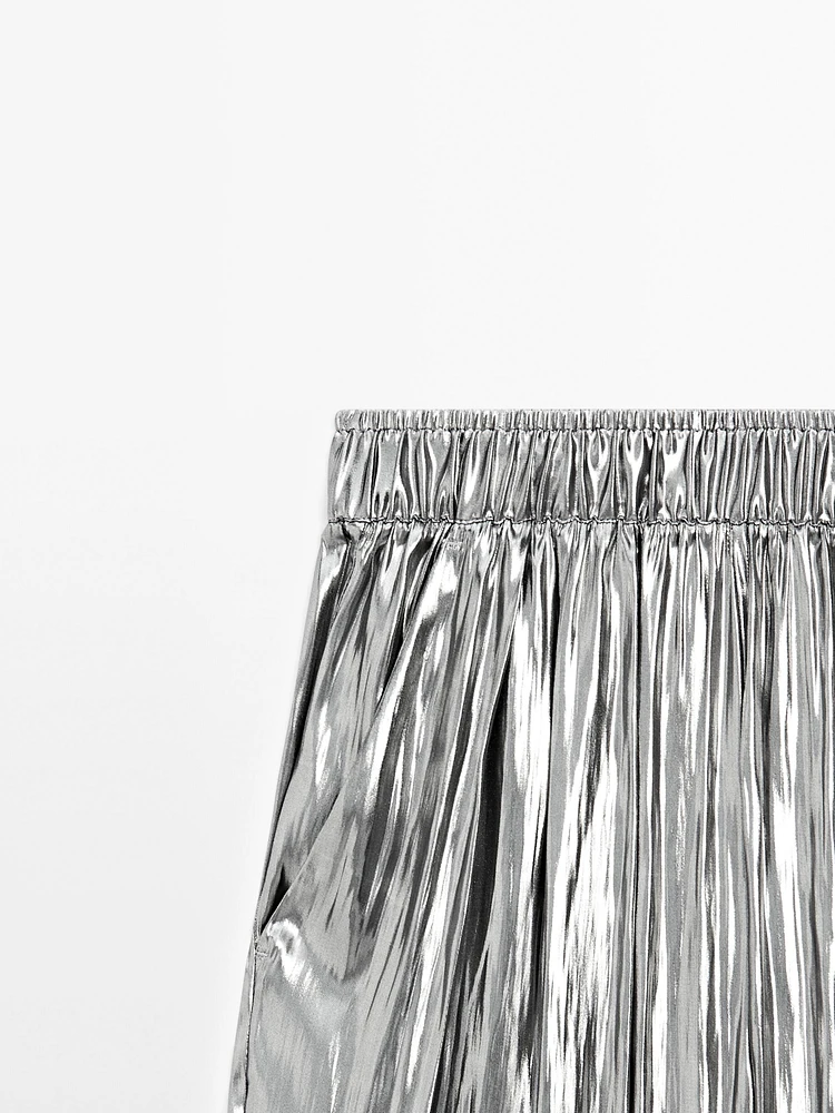 Flowing metallic trousers with gathered detail