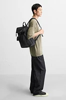RUBBERIZED FLAP BACKPACK